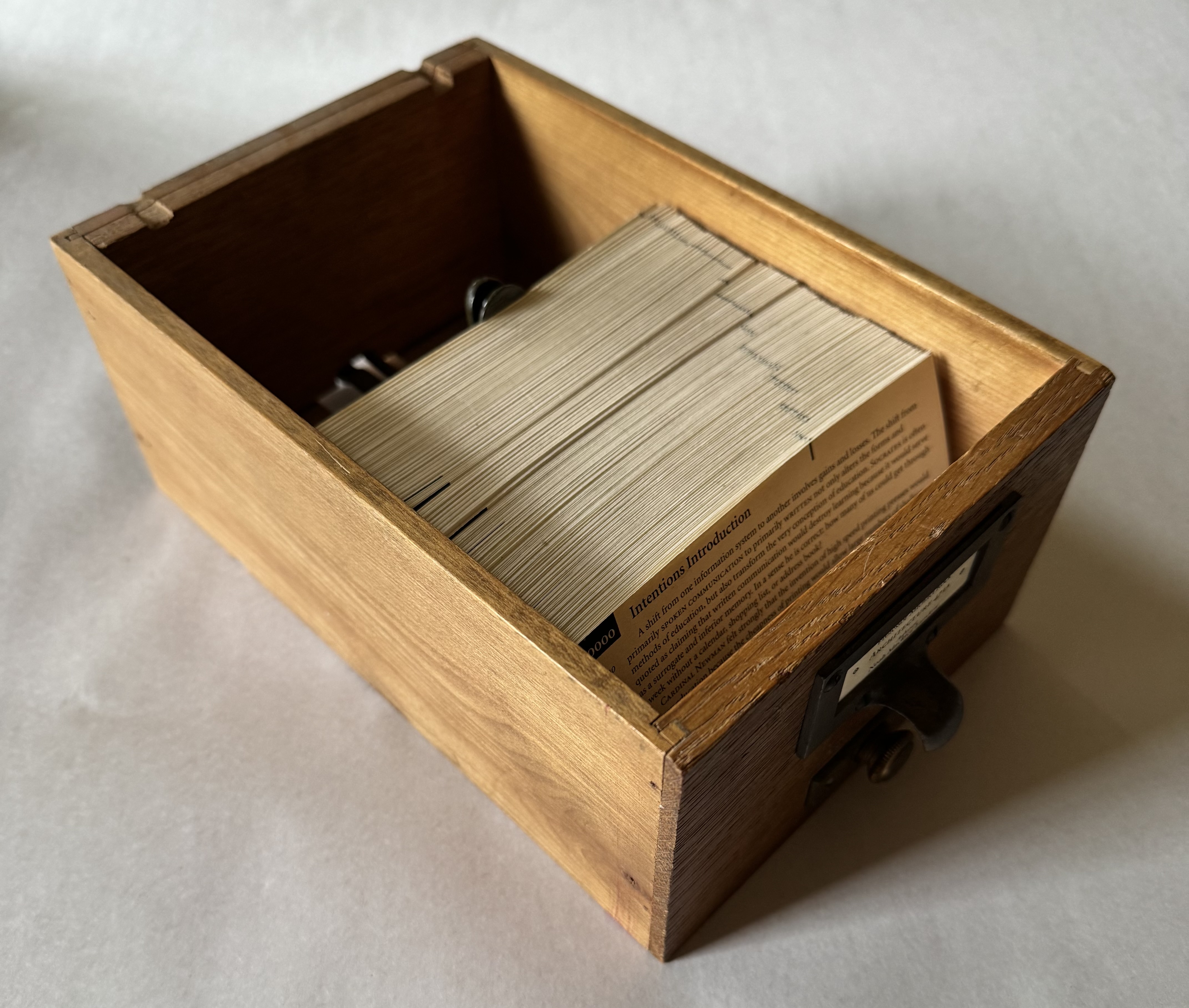 A salvaged card catalog drawer containing hundreds of 3x5 cards contaiing an architecture senior thesis from 1995.